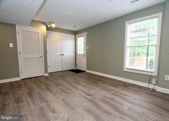 9600 Becker Ct, Fredericksburg, VA 22408 - entryway with a textured ceiling, baseboards, a healthy amount of sunlight, and wood finished floors