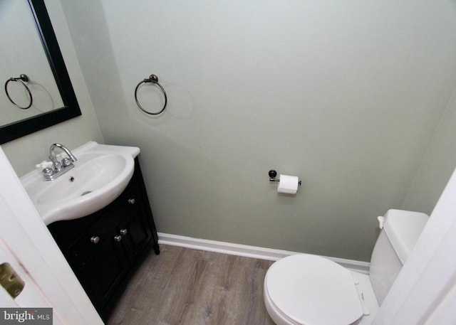 9600 Becker Ct, Fredericksburg, VA 22408 - bathroom featuring toilet, baseboards, wood finished floors, and vanity