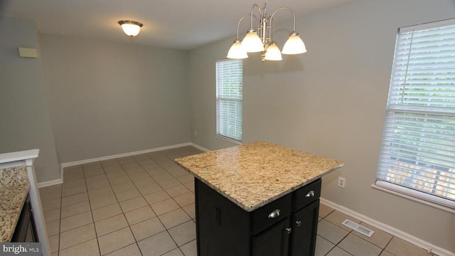 9600 Becker Ct, Fredericksburg, VA 22408 - kitchen with light tile patterned flooring, visible vents, an inviting chandelier, a center island, and dark cabinetry