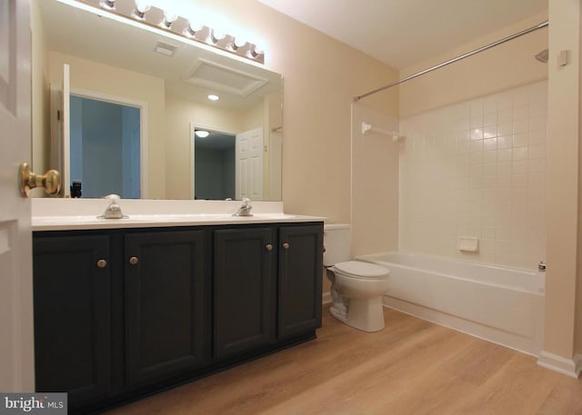 9600 Becker Ct, Fredericksburg, VA 22408 - bathroom with toilet,  shower combination, a sink, double vanity, and wood finished floors