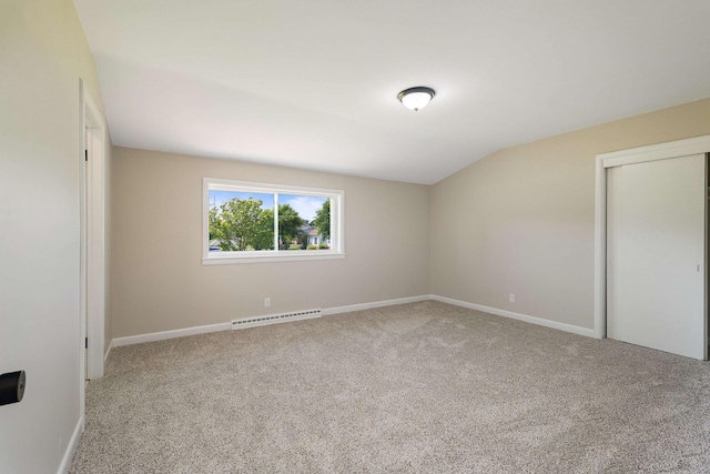 100 Monument Ave, Harrisonburg, VA 22801 - carpeted spare room with a baseboard heating unit, vaulted ceiling, and baseboards