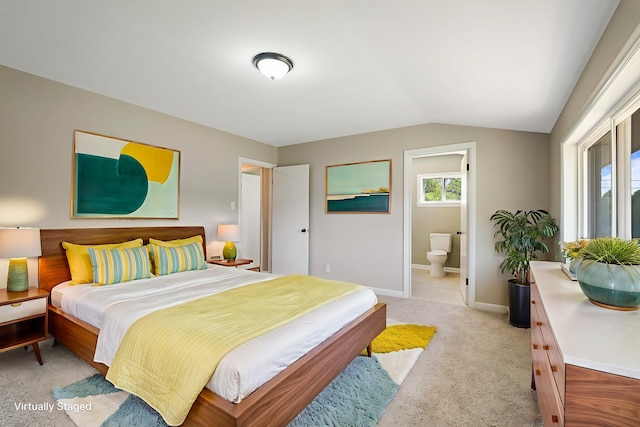 100 Monument Ave, Harrisonburg, VA 22801 - bedroom featuring lofted ceiling, light colored carpet, baseboards, and ensuite bath