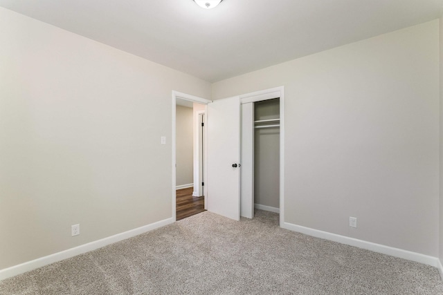 100 Monument Ave, Harrisonburg, VA 22801 - unfurnished bedroom with carpet flooring, baseboards, and a closet