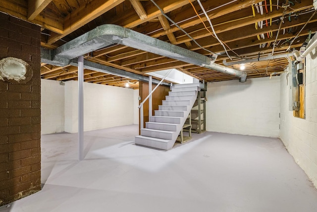 100 Monument Ave, Harrisonburg, VA 22801 - unfinished below grade area featuring stairs and concrete block wall