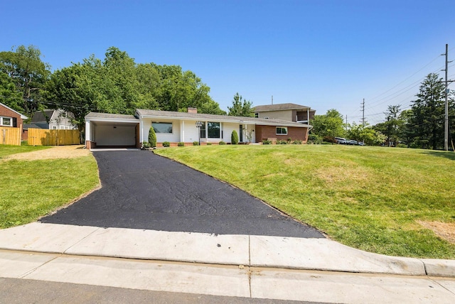 100 Monument Ave, Harrisonburg, VA 22801 - view of front of house featuring brick siding, asphalt driveway, a chimney, and a carport