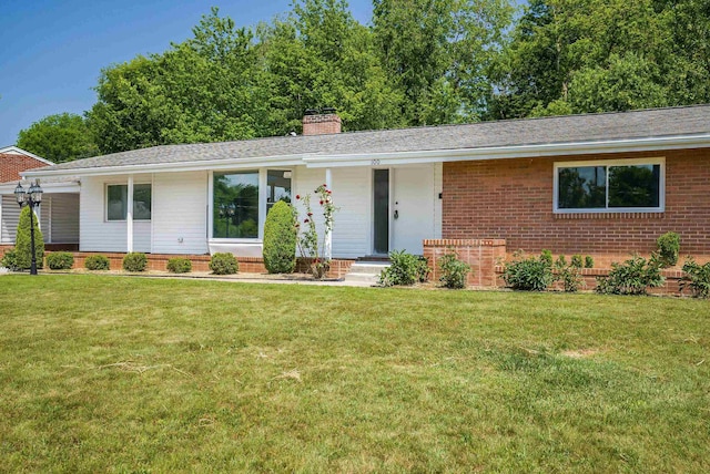 100 Monument Ave, Harrisonburg, VA 22801 - ranch-style house with brick siding, a chimney, a front lawn, and roof with shingles