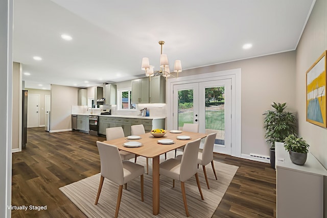 100 Monument Ave, Harrisonburg, VA 22801 - dining room featuring a chandelier, a baseboard radiator, dark wood-type flooring, baseboards, and recessed lighting