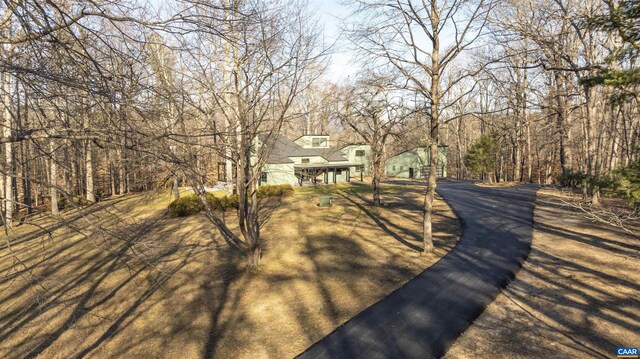 wooden terrace with a wooded view