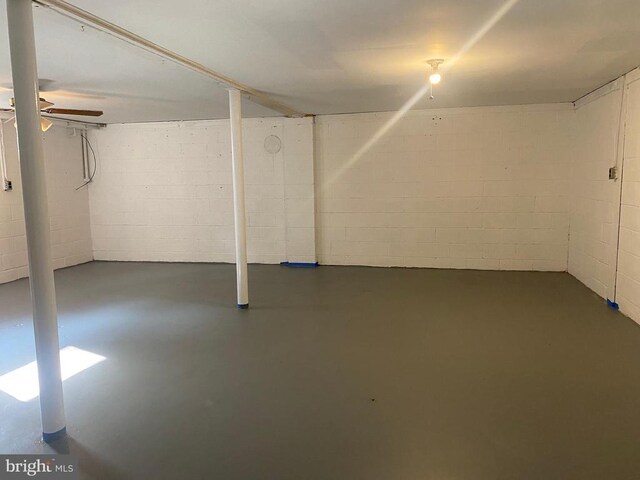  - unfinished basement featuring concrete block wall