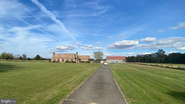  - view of front of house featuring a front lawn