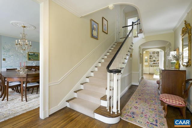 3809 Peakland Pl, Lynchburg, VA 24503 - stairway with arched walkways, wood finished floors, crown molding, and a chandelier