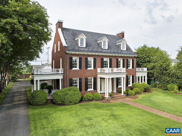 3809 Peakland Pl, Lynchburg, VA 24503 - colonial house with a balcony, a high end roof, a chimney, and brick siding