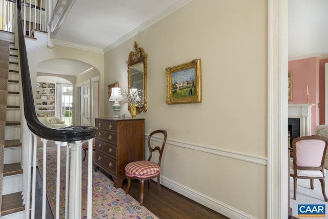 3809 Peakland Pl, Lynchburg, VA 24503 - entrance foyer featuring arched walkways, crown molding, baseboards, wood finished floors, and a fireplace