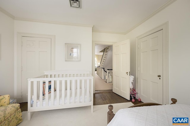 3809 Peakland Pl, Lynchburg, VA 24503 - bedroom featuring wood finished floors, ornamental molding, a closet, and a crib