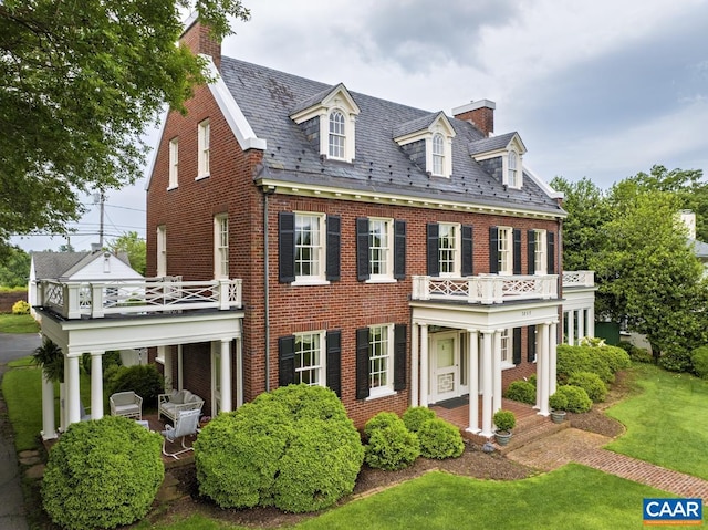 3809 Peakland Pl, Lynchburg, VA 24503 - colonial house with a high end roof, a balcony, brick siding, and a chimney