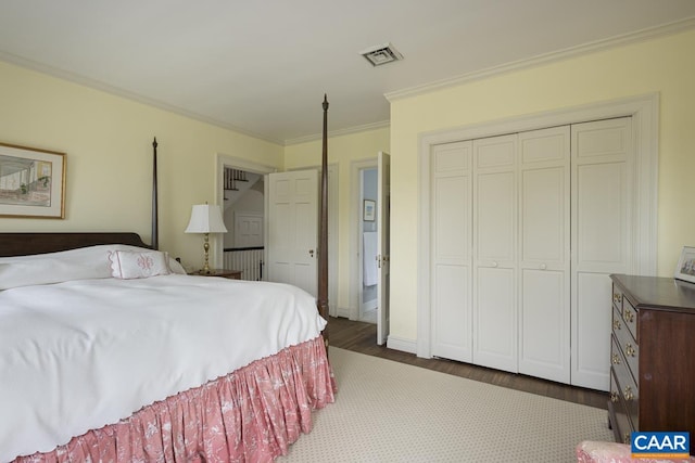 3809 Peakland Pl, Lynchburg, VA 24503 - bedroom with dark wood-style flooring, crown molding, and a closet