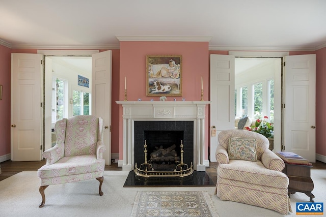 3809 Peakland Pl, Lynchburg, VA 24503 - living area featuring a fireplace with flush hearth, ornamental molding, baseboards, and wood finished floors