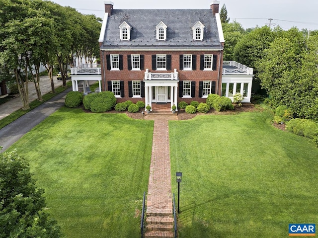 3809 Peakland Pl, Lynchburg, VA 24503 - colonial home featuring a chimney, a high end roof, brick siding, a front lawn, and a balcony