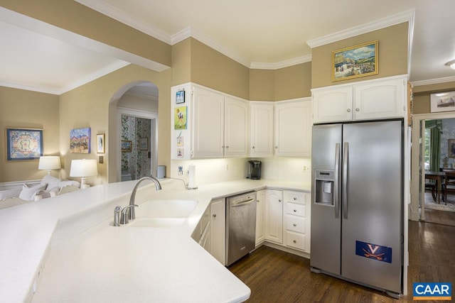 3809 Peakland Pl, Lynchburg, VA 24503 - kitchen with appliances with stainless steel finishes, a sink, dark wood finished floors, arched walkways, and a peninsula