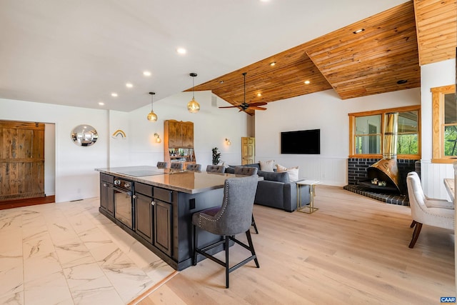 1900 Lowesville Rd, Amherst, VA 24521 - kitchen featuring black appliances, a center island, hanging light fixtures, recessed lighting, and vaulted ceiling