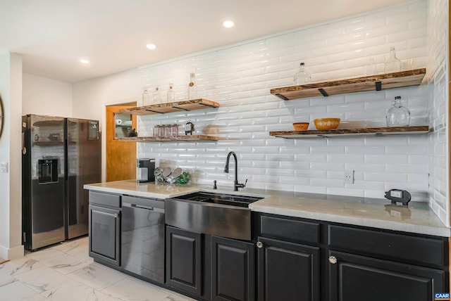 1900 Lowesville Rd, Amherst, VA 24521 - kitchen with open shelves, black fridge, a sink, dishwashing machine, and tasteful backsplash