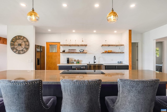 1900 Lowesville Rd, Amherst, VA 24521 - indoor wet bar with black electric cooktop, backsplash, recessed lighting, and decorative light fixtures