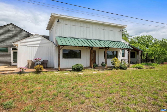 1900 Lowesville Rd, Amherst, VA 24521 - view of front of house featuring a front yard, a standing seam roof, metal roof, and covered porch