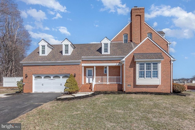 view of front facade featuring aphalt driveway, a garage, brick siding, roof with shingles, and a front lawn