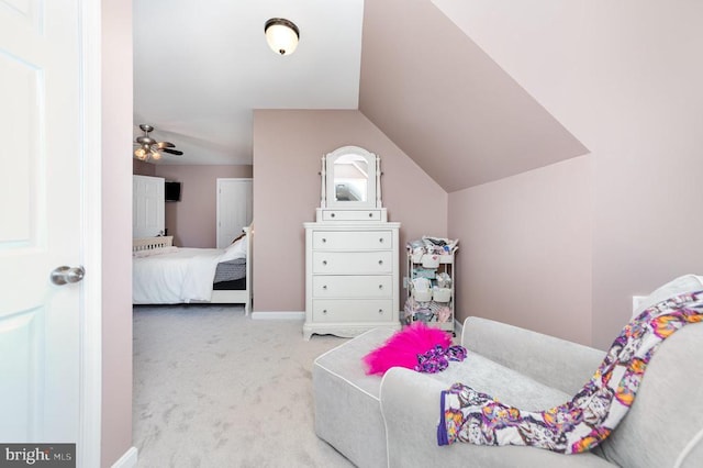 carpeted bedroom featuring lofted ceiling