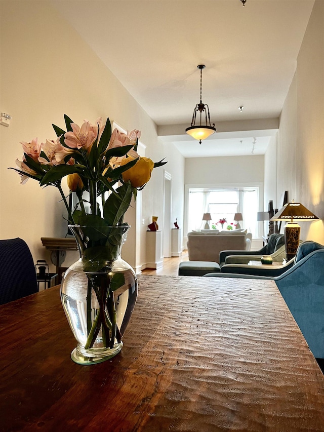 interior space with baseboards and wood finished floors