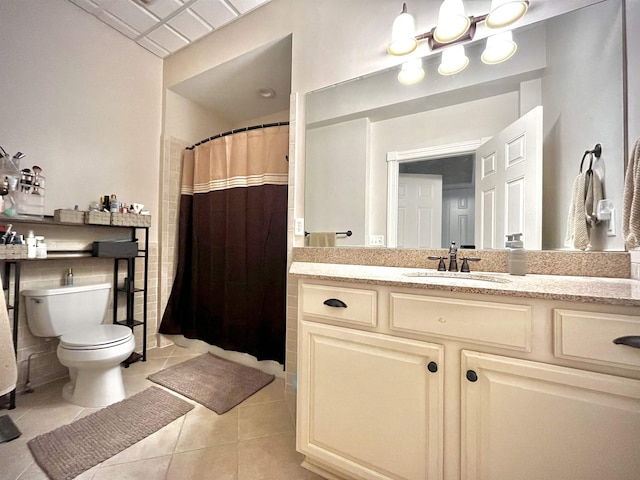 full bathroom with toilet, a shower with curtain, tile patterned floors, and vanity