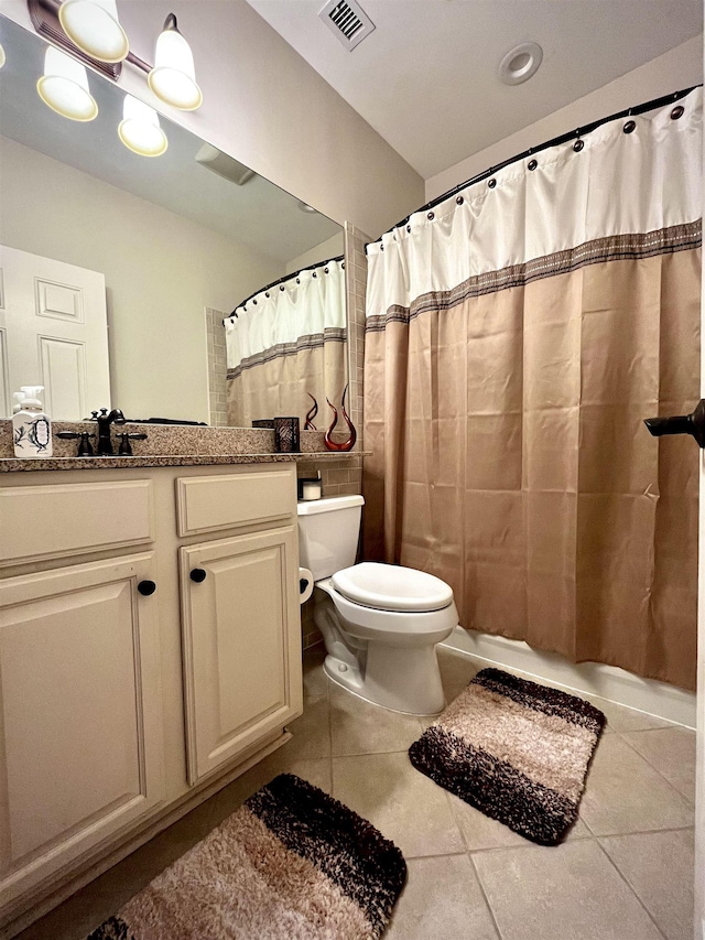 bathroom with toilet, visible vents, tile patterned flooring, and curtained shower