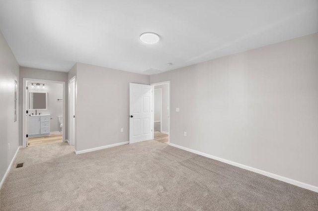 1024 D St, Waynesboro, VA 22980 - unfurnished bedroom with light carpet and ensuite bathroom
