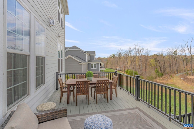deck featuring outdoor dining area