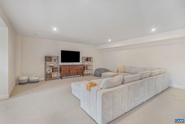 living area featuring recessed lighting, light colored carpet, and baseboards
