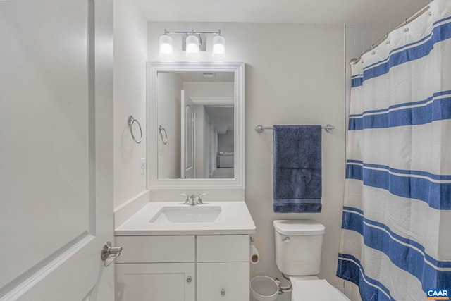 full bathroom with vanity, toilet, and a shower with shower curtain
