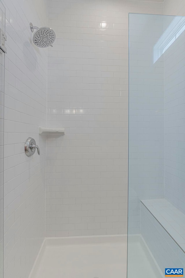 full bath featuring a shower stall