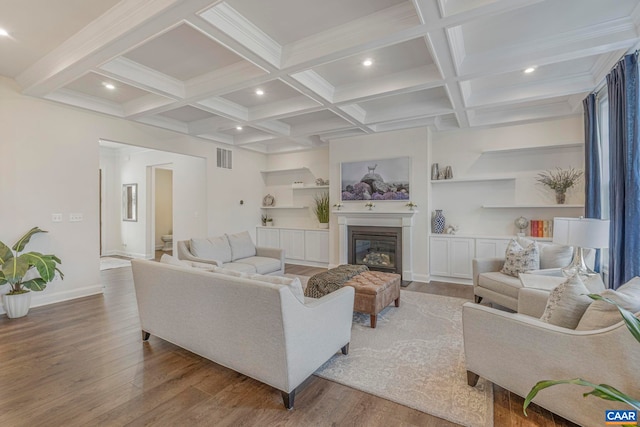 living area with recessed lighting, wood finished floors, beamed ceiling, coffered ceiling, and baseboards