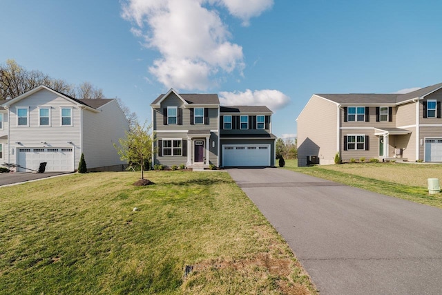 1113 Scruggs Ln, Grottoes, VA 24441 - traditional-style house featuring a front lawn, driveway, and an attached garage