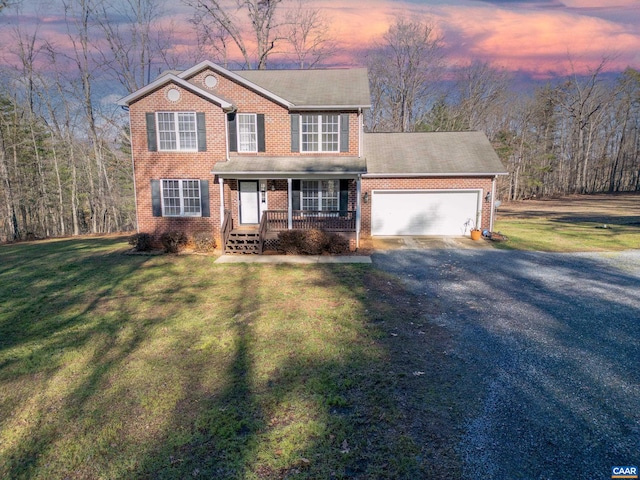 4259 Shelby Rd, Rochelle, VA 22738 - traditional-style home with an attached garage, a lawn, a porch, brick siding, and gravel driveway