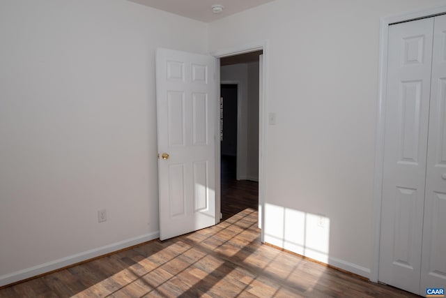 4259 Shelby Rd, Rochelle, VA 22738 - unfurnished bedroom featuring baseboards, a closet, and wood finished floors