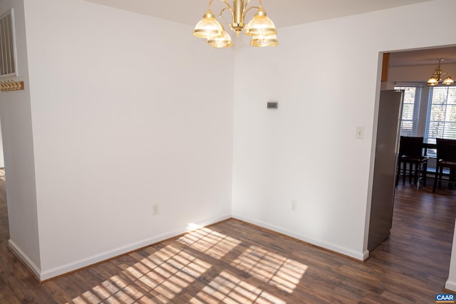 4259 Shelby Rd, Rochelle, VA 22738 - unfurnished dining area featuring a chandelier, wood finished floors, and baseboards