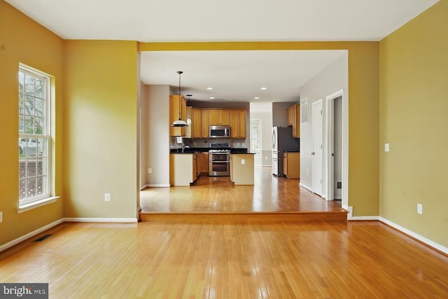 607 Woodruff Ln, Culpeper, VA 22701 - unfurnished living room featuring light wood-style floors, plenty of natural light, and recessed lighting