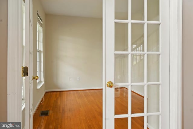 607 Woodruff Ln, Culpeper, VA 22701 - corridor featuring french doors and hardwood / wood-style floors