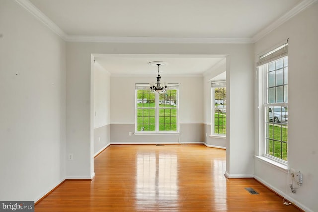 607 Woodruff Ln, Culpeper, VA 22701 - unfurnished room with wood finished floors, a chandelier, and ornamental molding