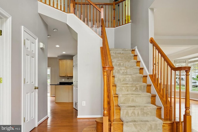 607 Woodruff Ln, Culpeper, VA 22701 - stairs featuring wood finished floors, a high ceiling, and recessed lighting