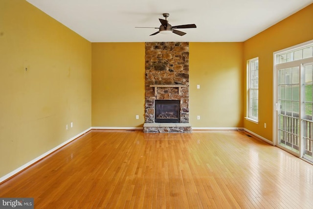 607 Woodruff Ln, Culpeper, VA 22701 - unfurnished living room with wood finished floors, ceiling fan, and a fireplace