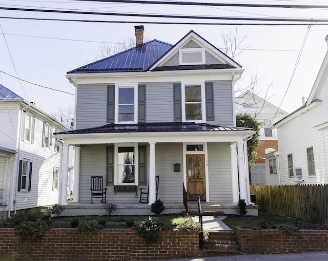 120 Jefferson St S, Lexington, VA 24450 - view of front of home with covered porch, fence, metal roof, and a standing seam roof