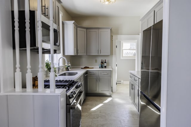 120 Jefferson St S, Lexington, VA 24450 - kitchen with stainless steel appliances, a sink, gray cabinets, light countertops, and baseboard heating