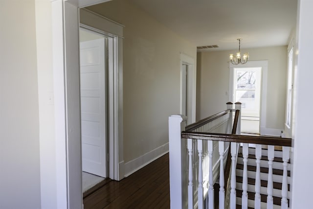120 Jefferson St S, Lexington, VA 24450 - hallway featuring an upstairs landing, a chandelier, dark wood-style flooring, and baseboards